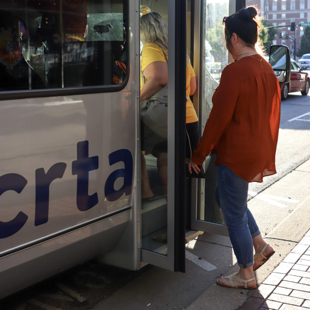 people boarding a bus